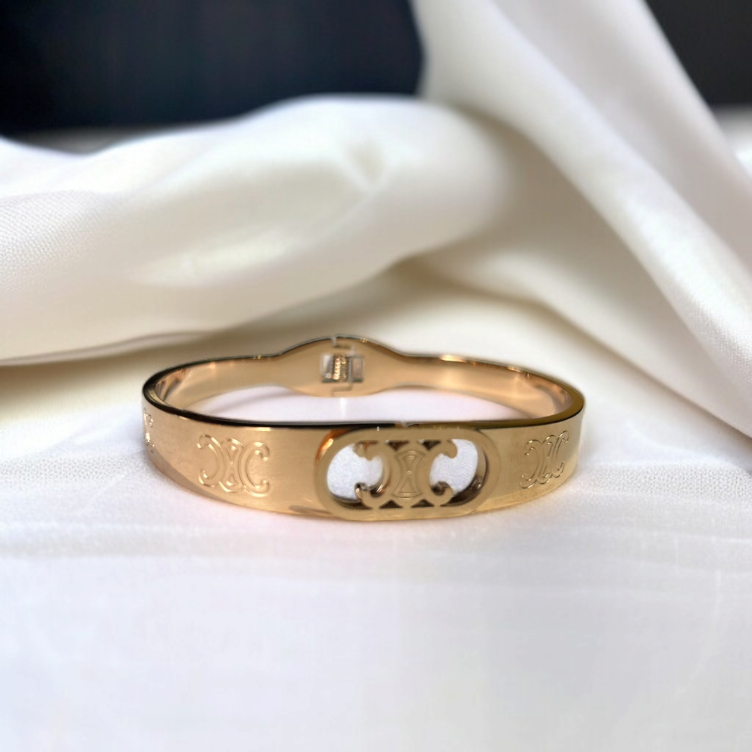 Elegant Rose Gold Bangle Bracelet with Signature Engraved Detailing